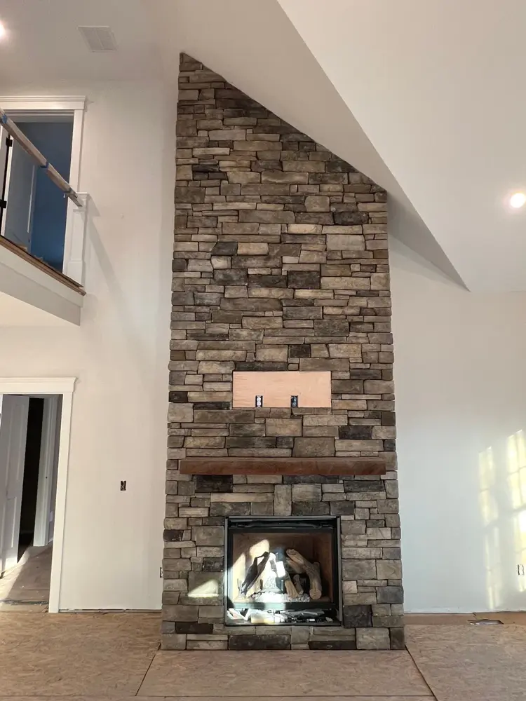 Stone fireplace with raised hearth