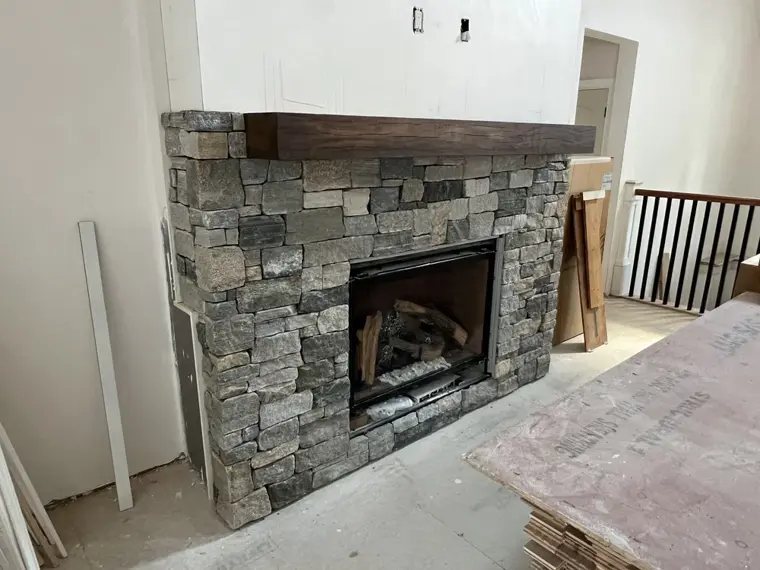 Fieldstone fireplace with mantel