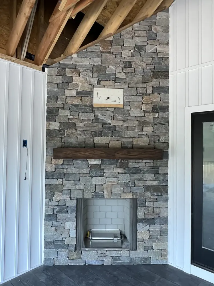 Stone fireplace with timber mantel