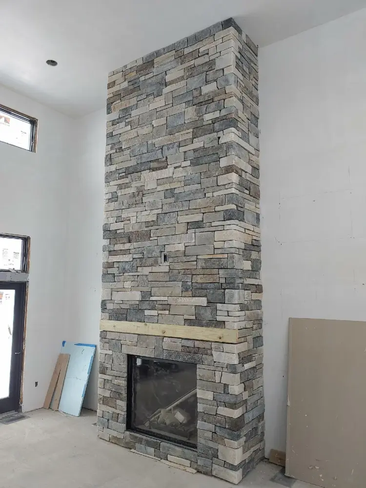 Floor-to-ceiling stone fireplace