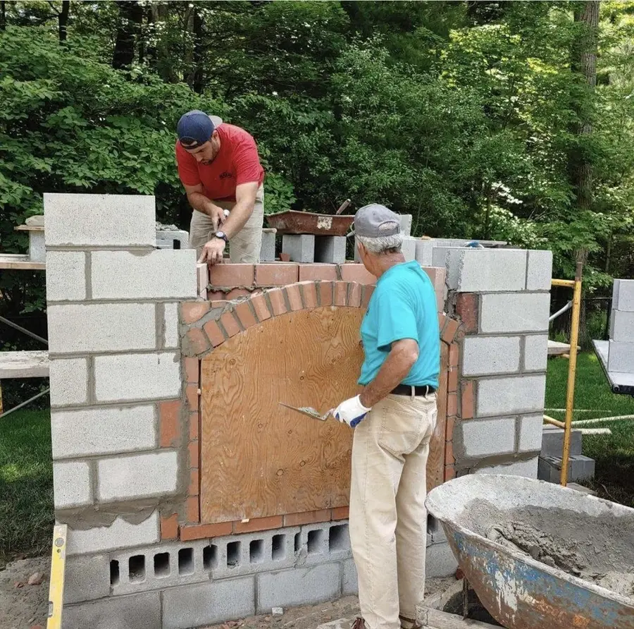 Steve and Craig Ramsay building a masonry fireplace